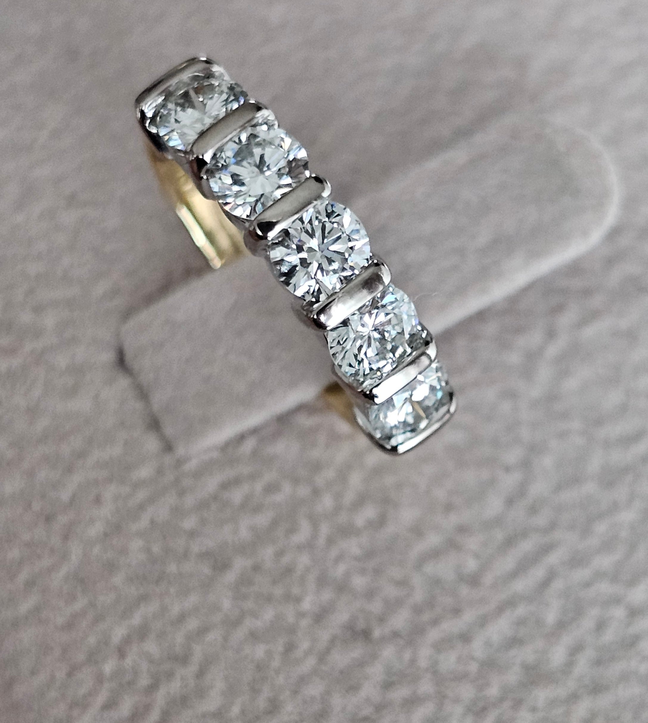Diamond ring on a textured gray surface