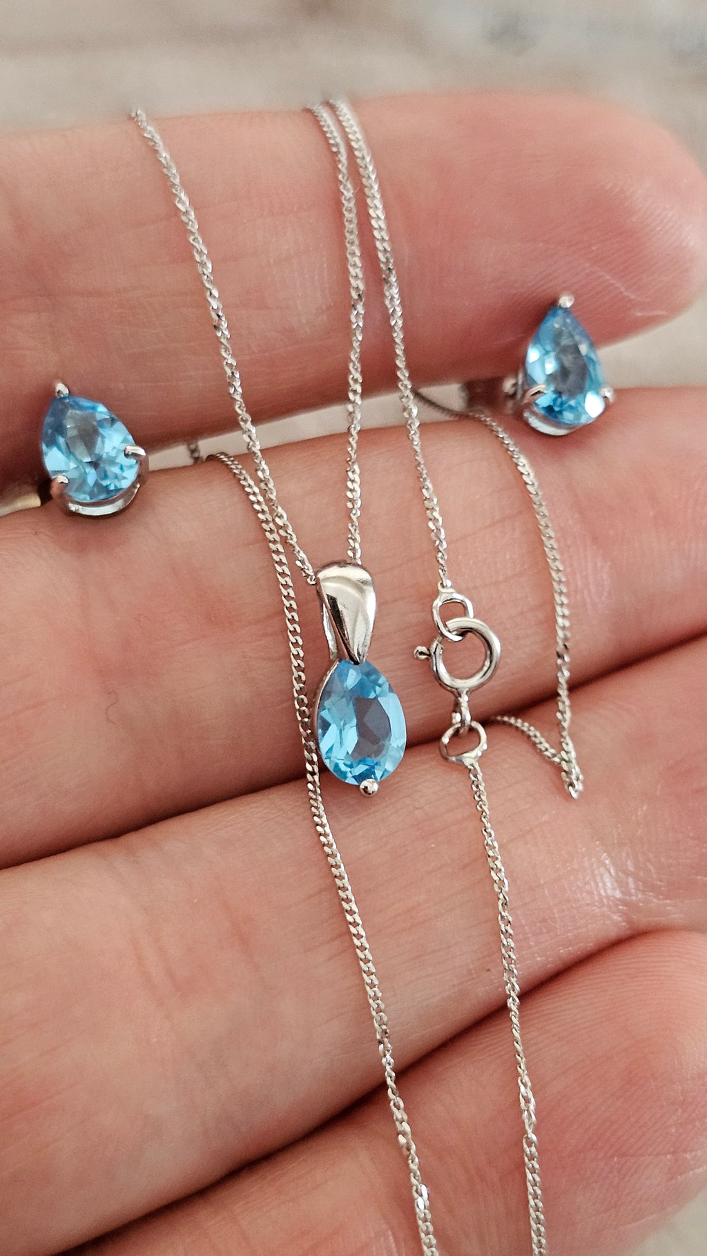 Elegant 9ct White Gold and Pear Cut Blue Topaz Jewellery Suite – Pendant & Earrings