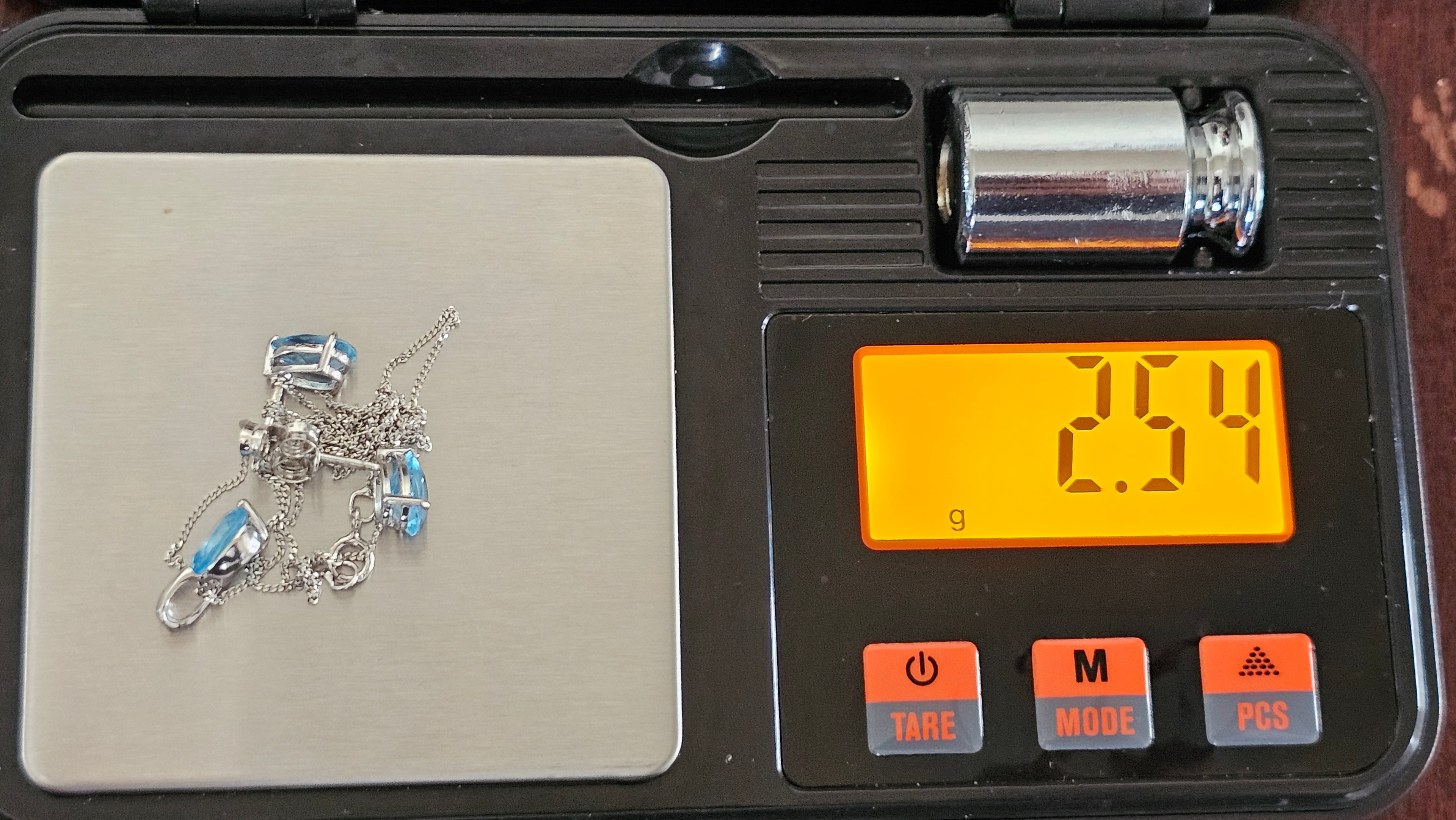 Elegant 9ct White Gold and Pear Cut Blue Topaz Jewellery Suite – Pendant & Earrings