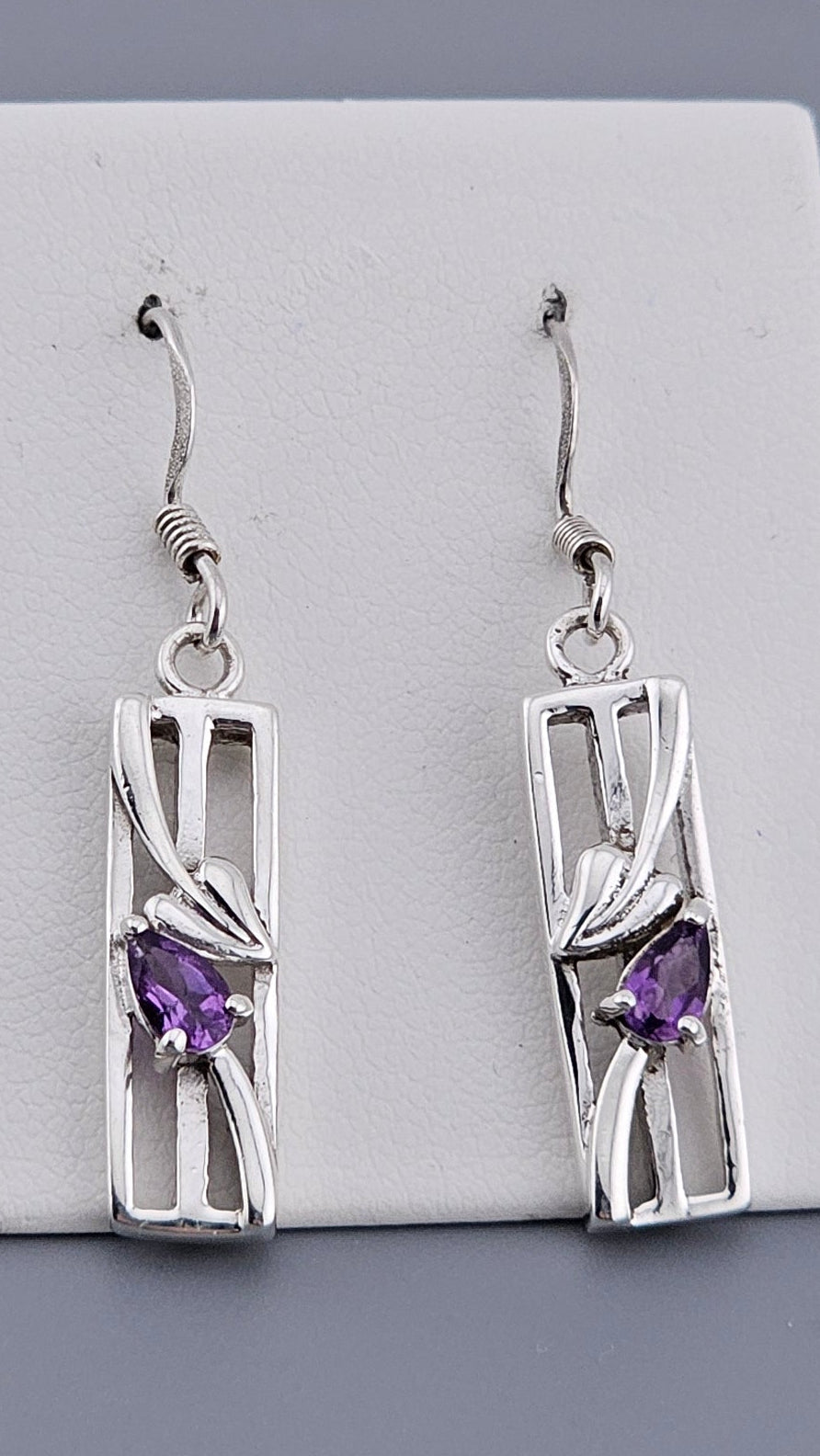 Vintage 925 Sterling Silver Amethyst Drop Dangle Earrings with a design inspired by Charles Rennie Mackintosh featuring a single purple Amethyst stone pear cut on the centre of each earrings. Shop Now at Jewel Standard House!