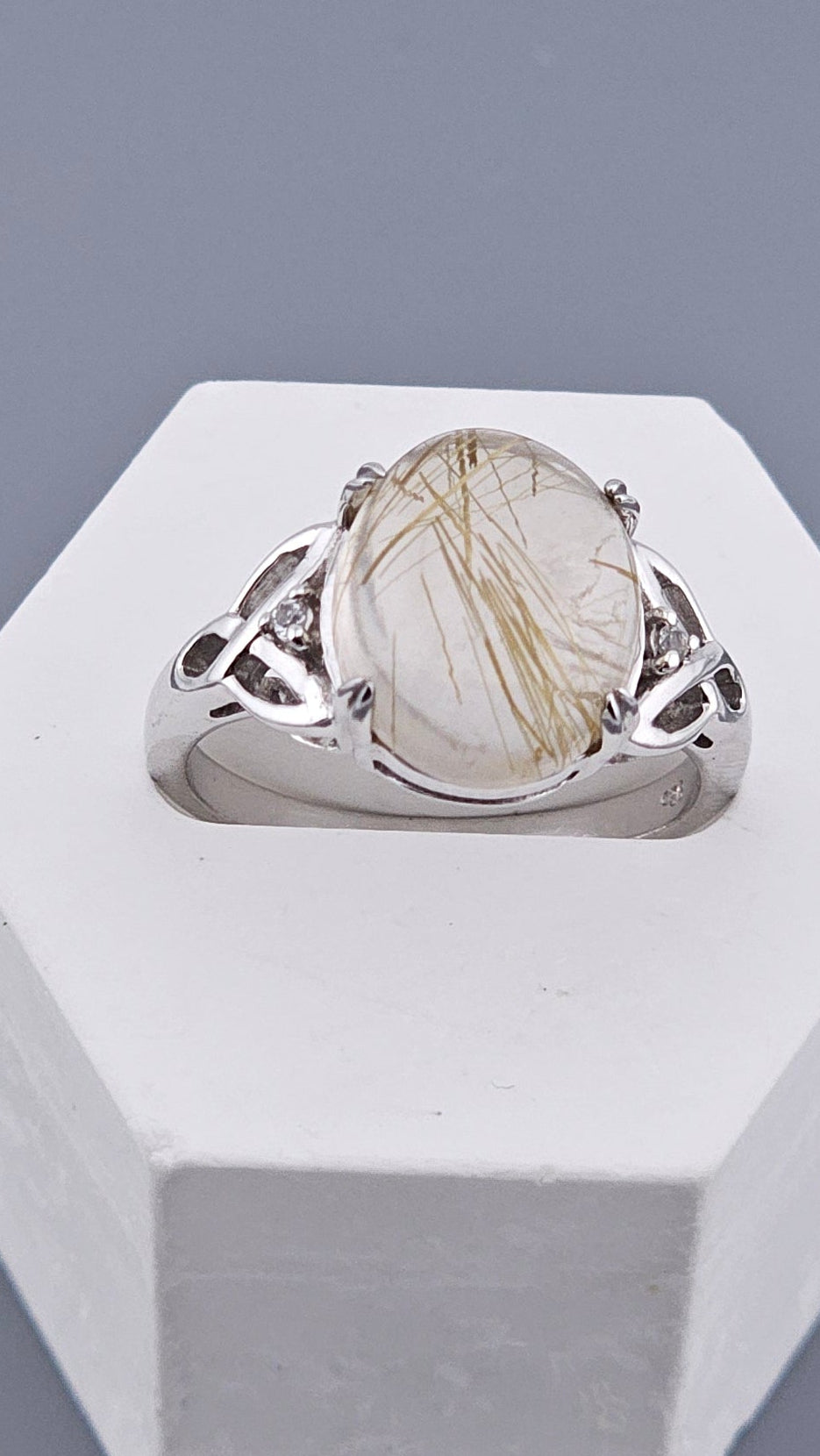 Vintage 925 Sterling Silver Golden Rutilated Quartz Ring featuring a large oval cabochon with golden needle inclusions and a celtic knot band. Shop now at Jewel Standard House!